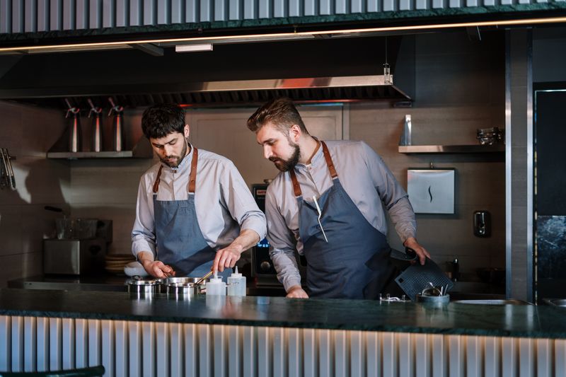 The passionate dream team behind Jet's pizza preparing fresh meals