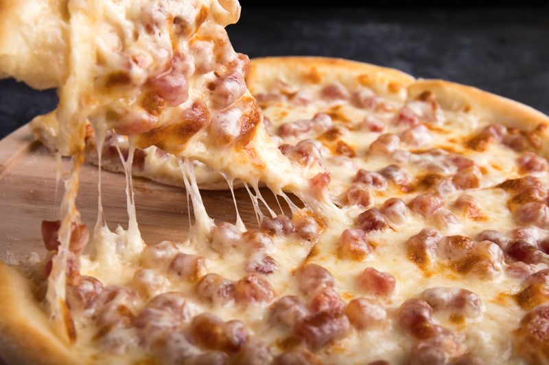 Artisan deep dish pizza with thick crust fresh out of the oven