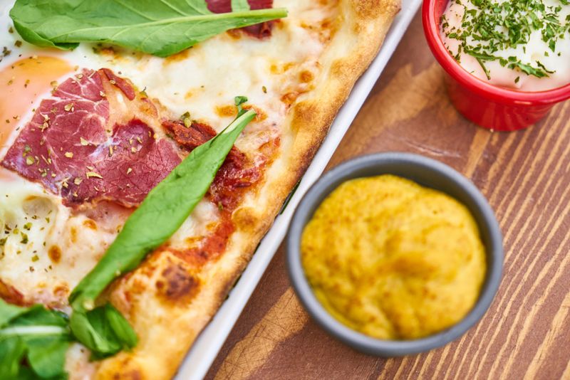Four cheese pizza delight with bubbling mozzarella and rich flavors